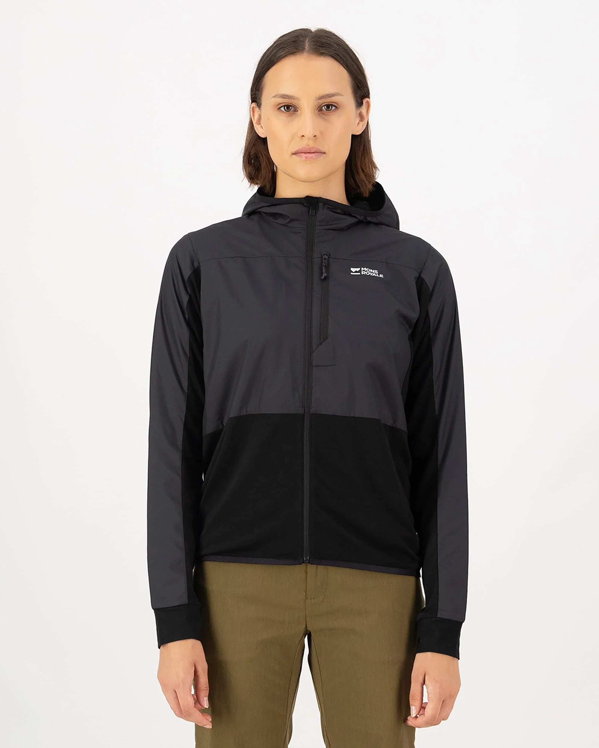 Person wearing a black and gray jacket with a visible brand logo on a white background