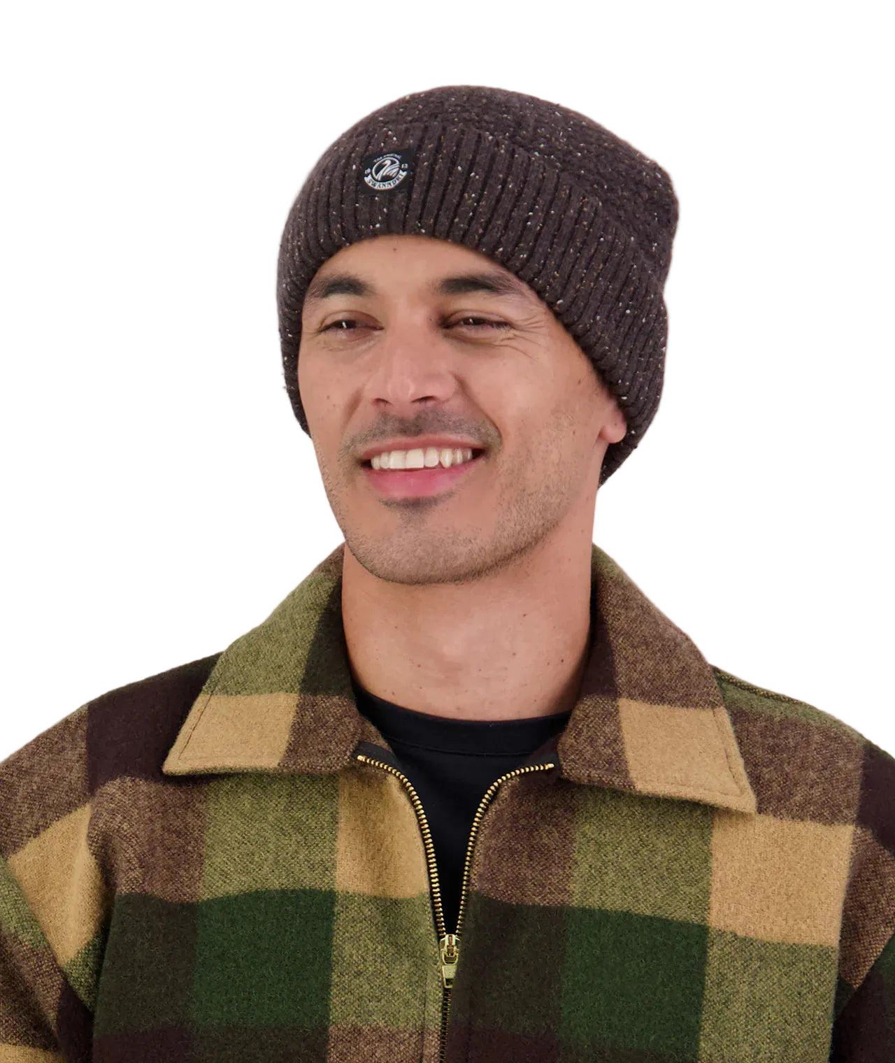 Man wearing a checkered jacket and knit beanie on a white background