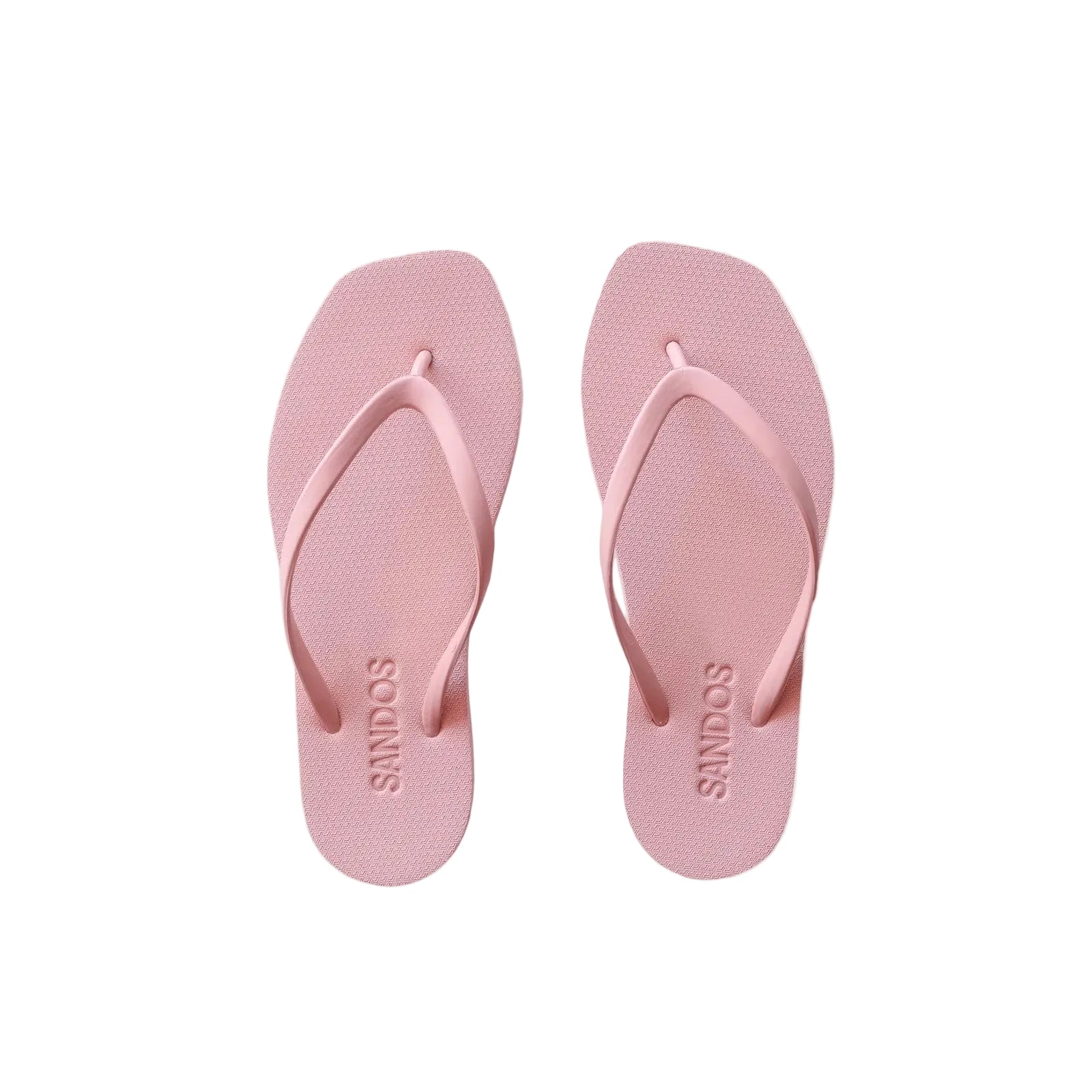 Pair of pink flip-flops with 'SANDOS' branding on a light beige background