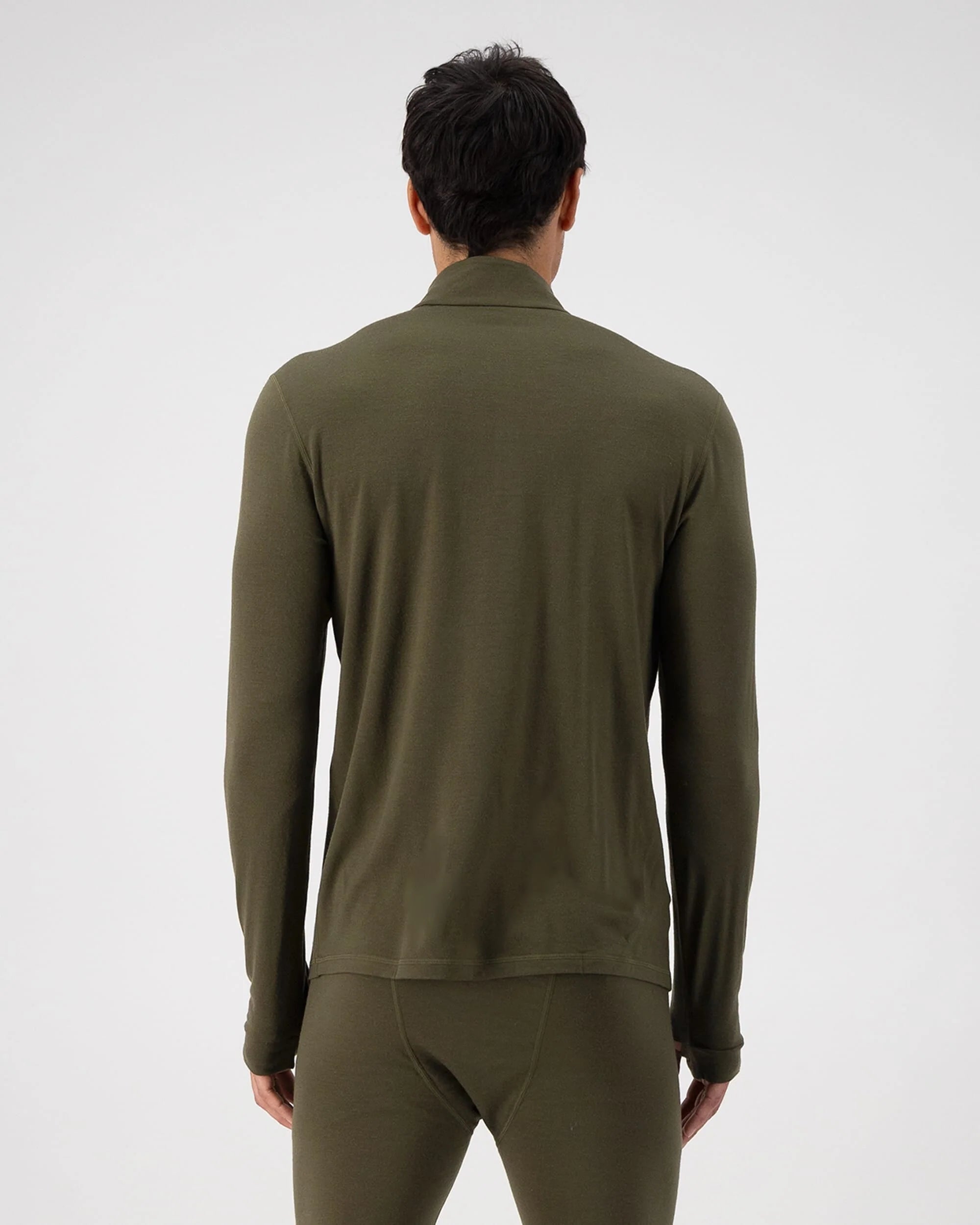 Person wearing an olive green long-sleeve shirt and pants on a white background