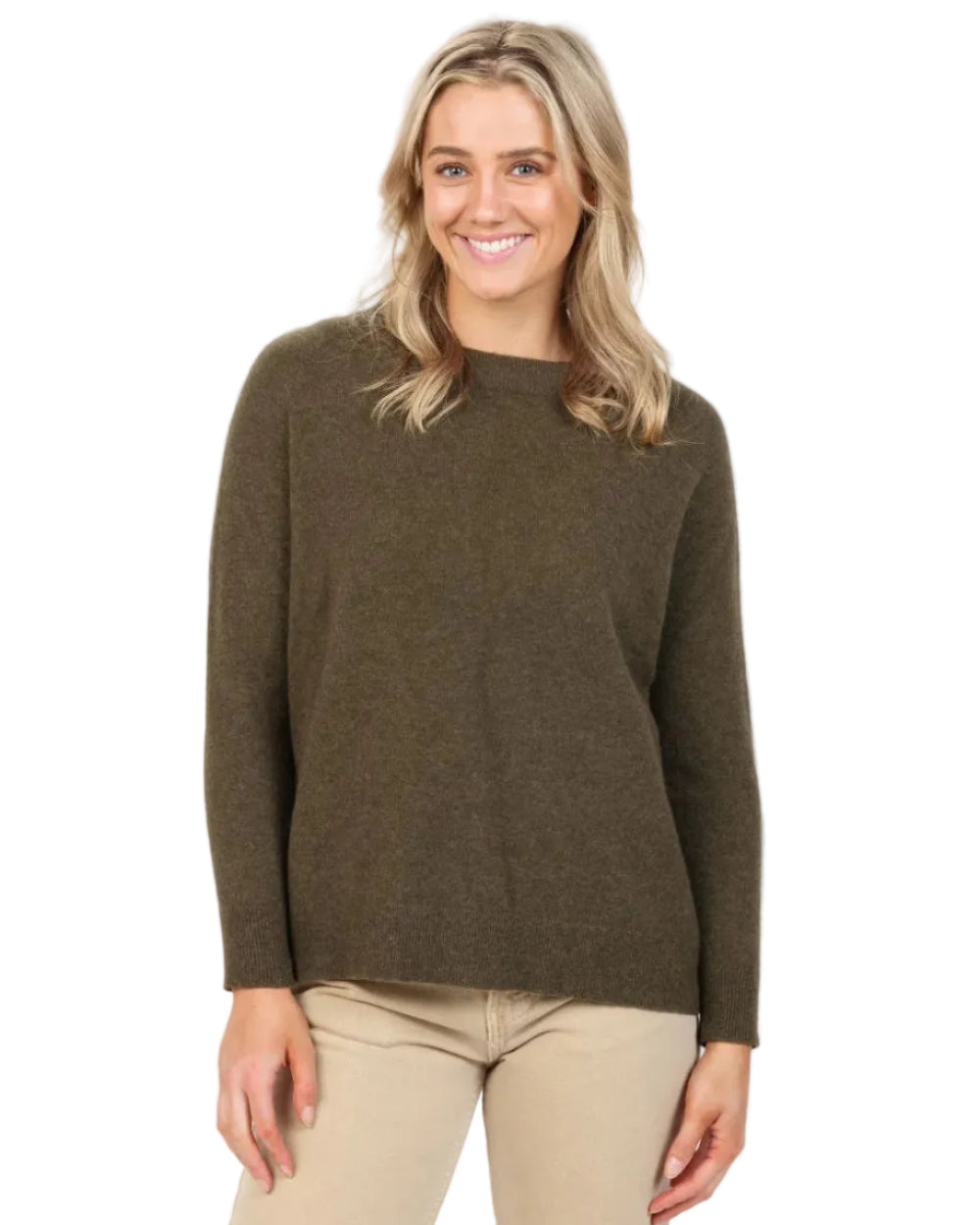 Woman wearing a brown sweater and beige pants on a white background