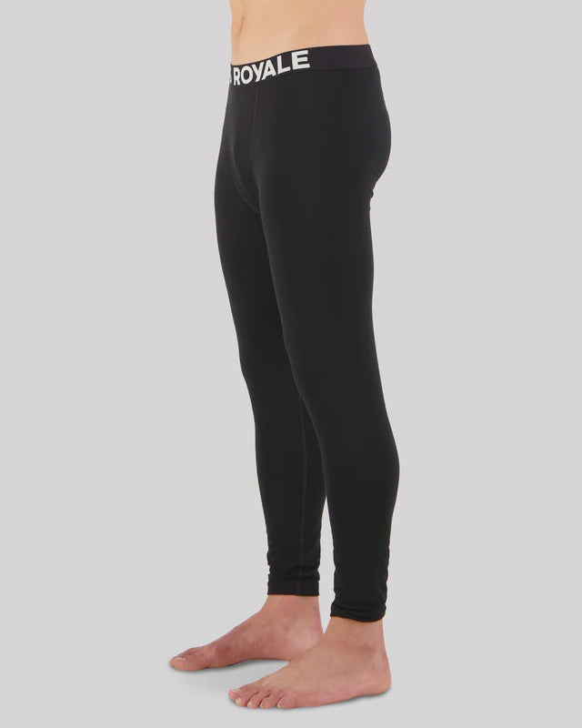 Black leggings with Mons Royale branding on a gray background