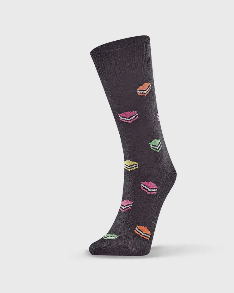 Dark gray sock with colorful dessert pattern on a light gray background
