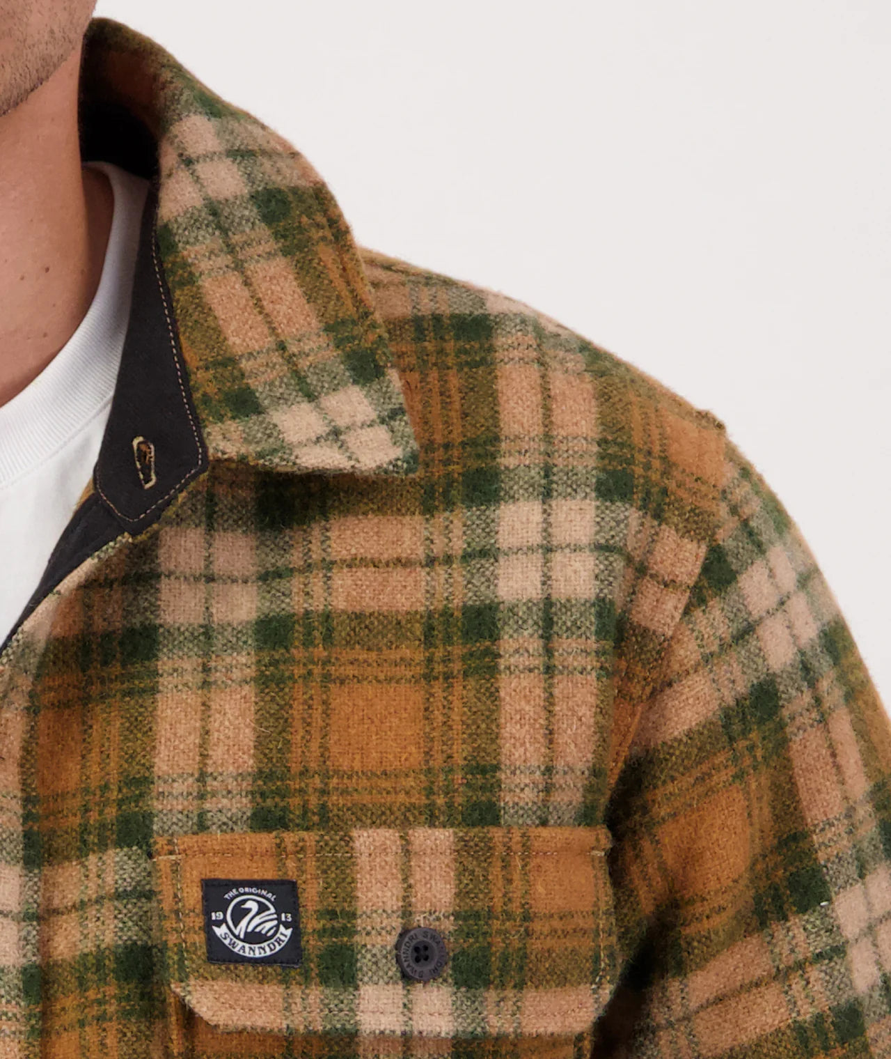 Plaid jacket with a visible brand logo on a white background