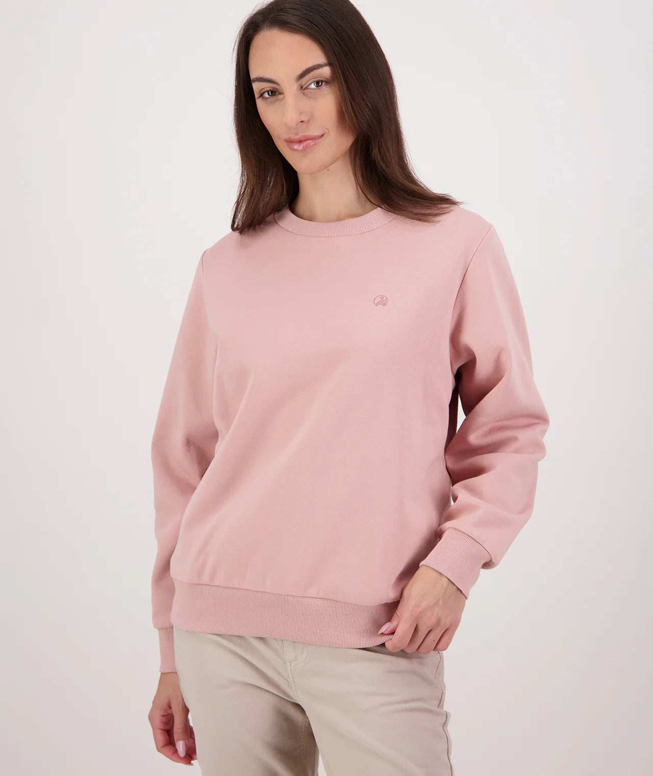 Woman wearing a pink sweatshirt on a white background