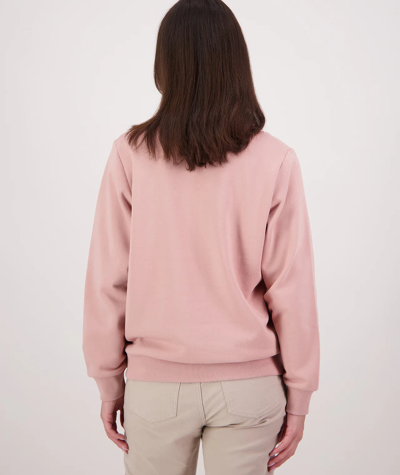 Person wearing a pink sweatshirt on a white background