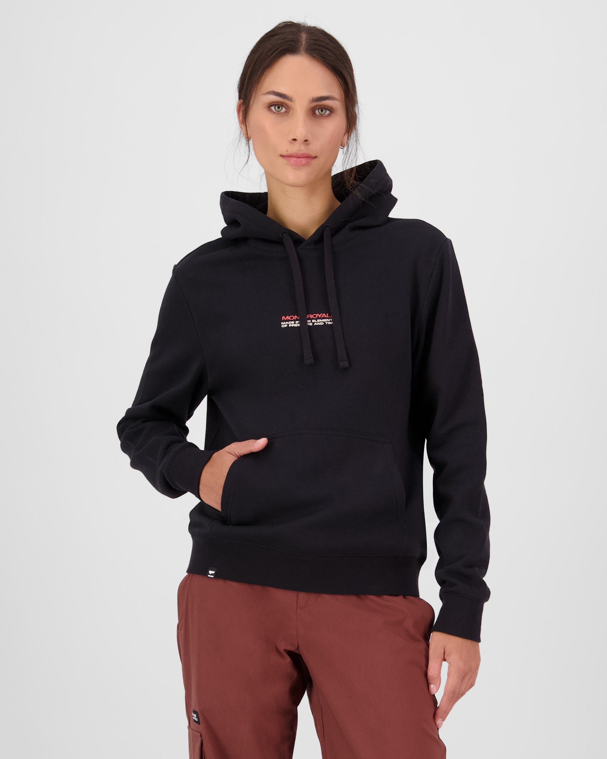 Person wearing a black hoodie with Mons Royale logo on a white background