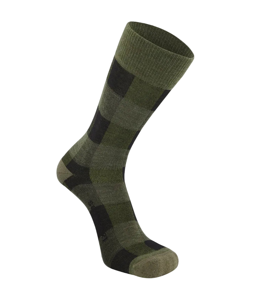 Green and black patterned sock on a white background